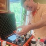 A man is working on an electronic device.