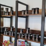 A room filled with shelves of different types of food.
